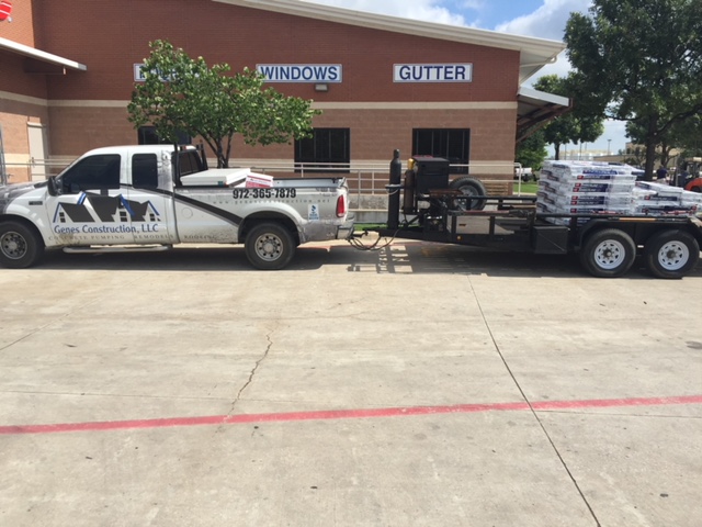 Genes Construction roofing truck towing a trailer of architectural shingles for a Dallas–Fort Worth roof replacement